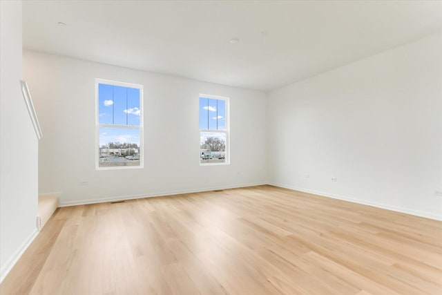 1121 Girard Ave, Des Plaines, IL 60018 - spare room featuring light wood-style floors and baseboards