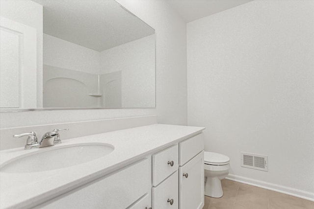 1121 Girard Ave, Des Plaines, IL 60018 - bathroom with vanity, toilet, tile patterned floors, and baseboards