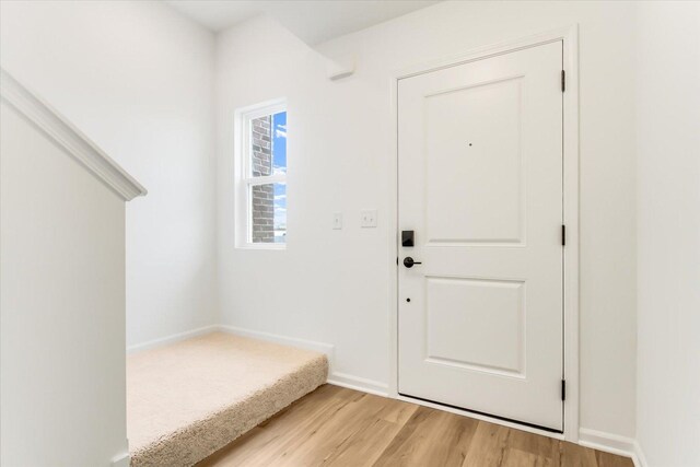 1121 Girard Ave, Des Plaines, IL 60018 - foyer with light wood-style floors and baseboards