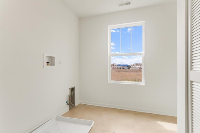 1121 Girard Ave, Des Plaines, IL 60018 - washroom with washer hookup, light tile patterned floors, and baseboards