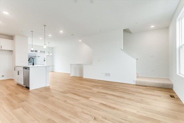 1121 Girard Ave, Des Plaines, IL 60018 - unfurnished living room with light wood finished floors, recessed lighting, and baseboards