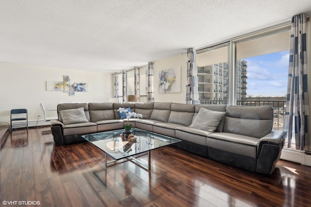 living room with dark wood-style floors and a textured ceiling