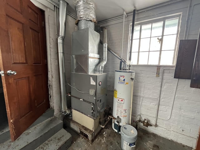 utility room with heating unit and water heater