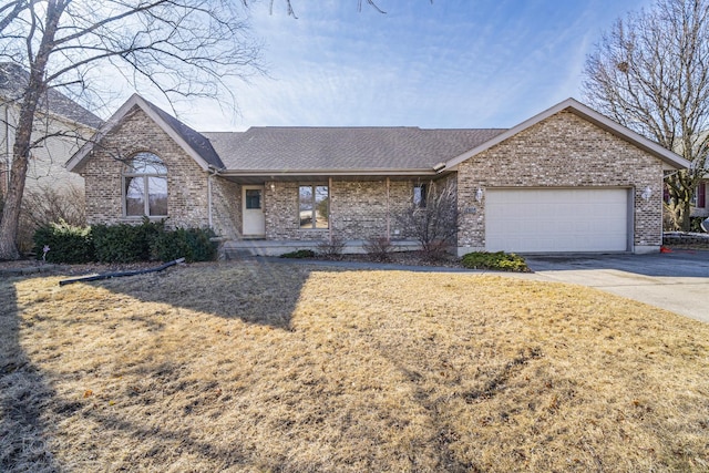 ranch-style house with an attached garage, brick siding, driveway, roof with shingles, and a front yard