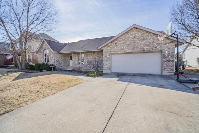 ranch-style house with driveway, an attached garage, and brick siding