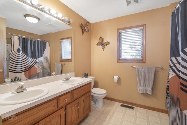 full bath with visible vents, a sink, and tile patterned floors