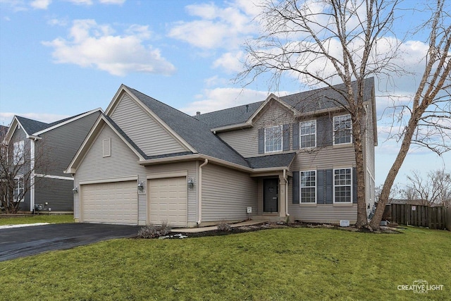 view of front of house featuring aphalt driveway, an attached garage, fence, roof with shingles, and a front lawn