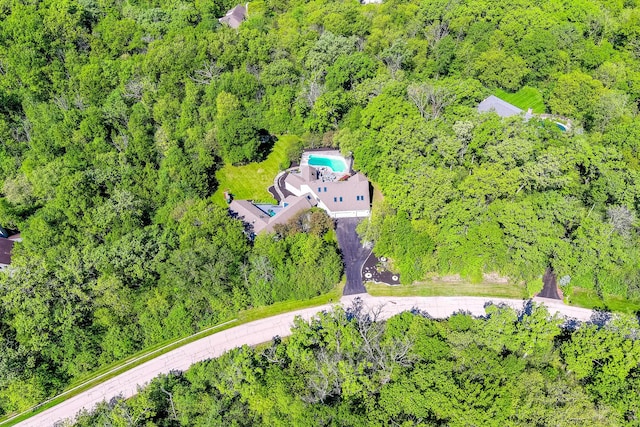 aerial view featuring a wooded view