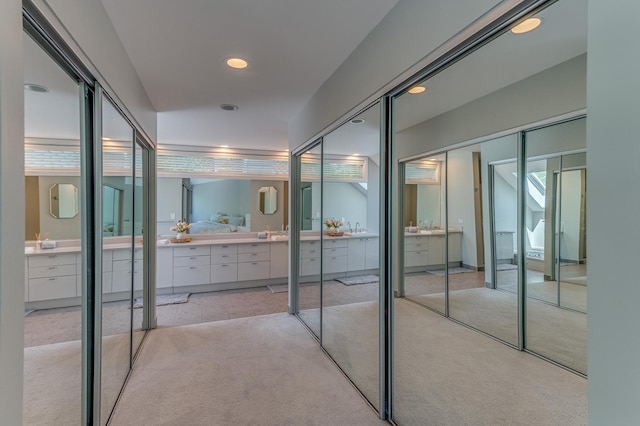 interior space with recessed lighting, carpet flooring, and vanity