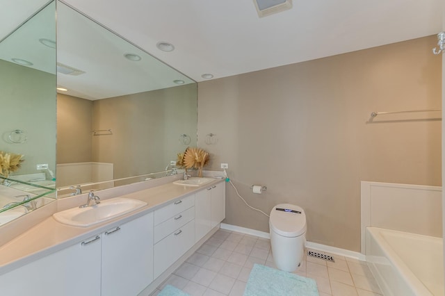 bathroom with double vanity, tile patterned flooring, visible vents, and a sink