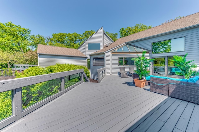 wooden deck featuring outdoor lounge area