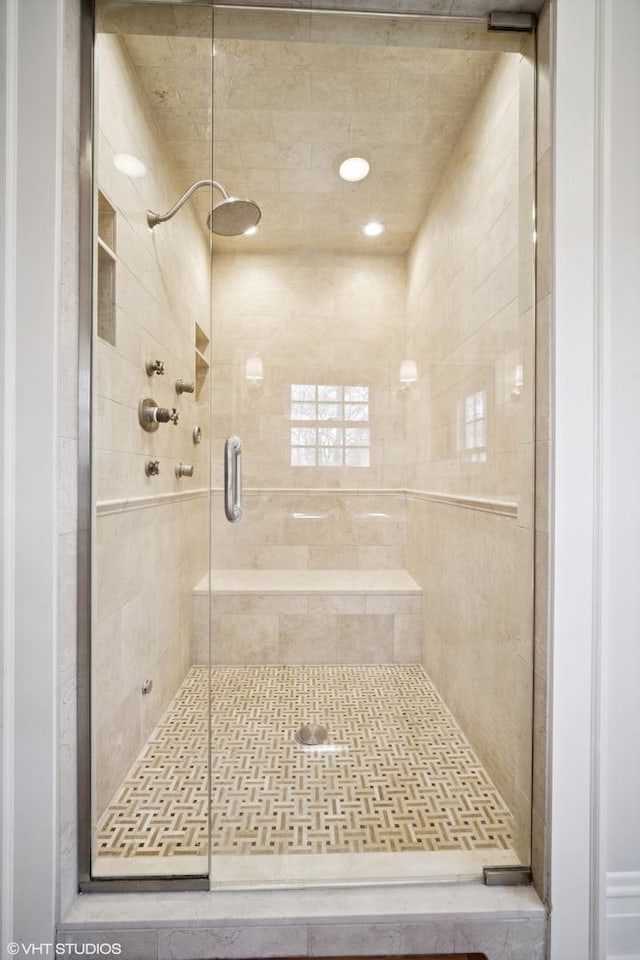 full bathroom featuring a stall shower