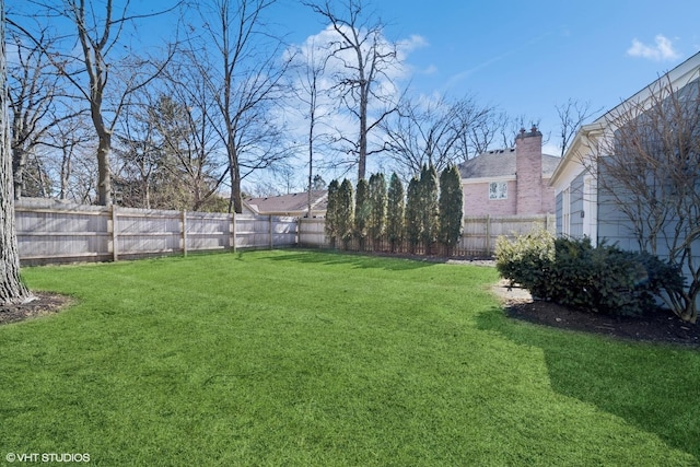 view of yard featuring a fenced backyard