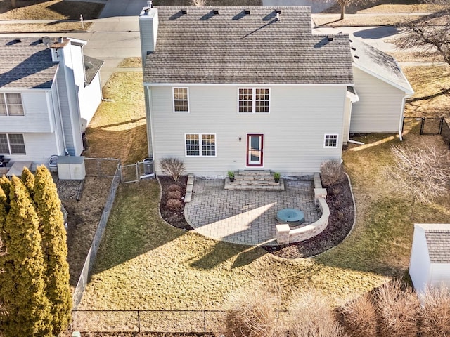 back of property with roof with shingles, a patio, entry steps, fence, and cooling unit