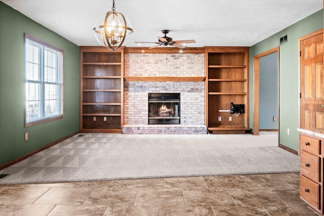 unfurnished living room with carpet floors, a brick fireplace, and built in features