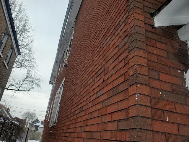 view of property exterior featuring brick siding