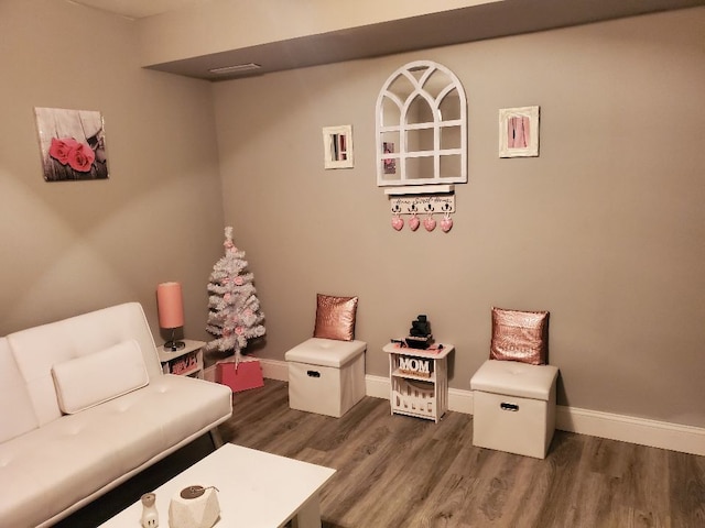 sitting room featuring dark wood-style floors and baseboards