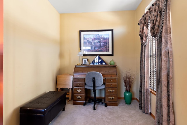 home office with light carpet and baseboards