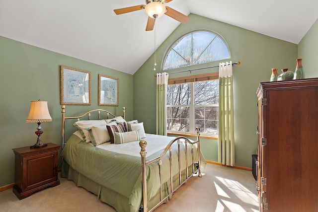 bedroom with lofted ceiling, ceiling fan, baseboards, and light colored carpet