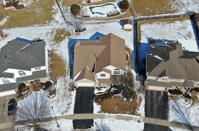 snowy aerial view featuring a residential view