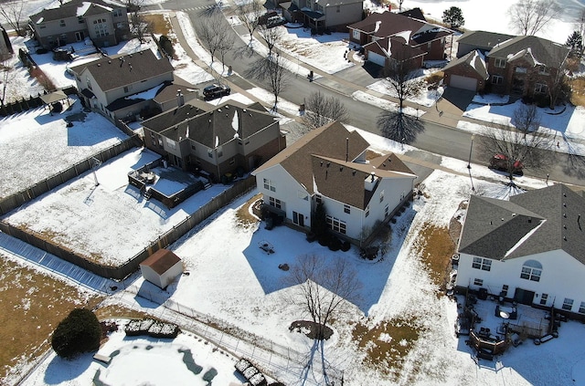 snowy aerial view featuring a residential view