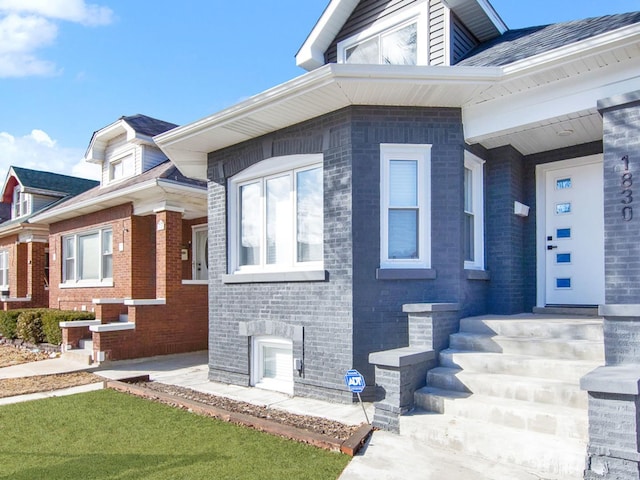 exterior space featuring brick siding