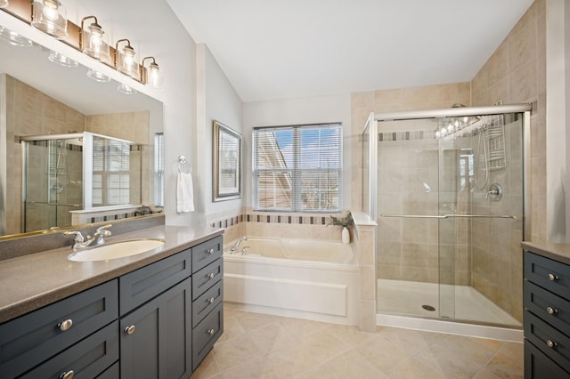 full bath featuring a bath, a stall shower, tile patterned flooring, and vanity