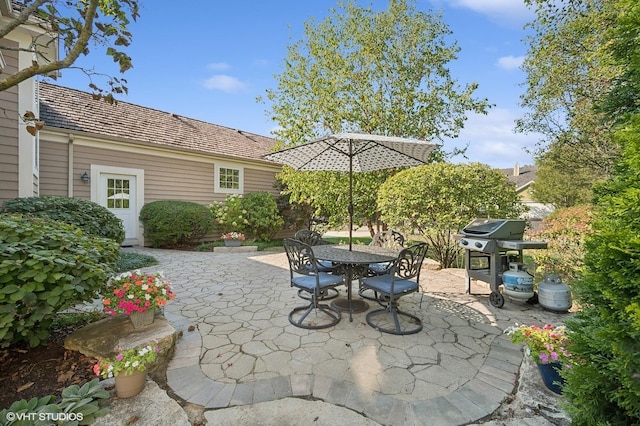 view of patio with outdoor dining space and area for grilling