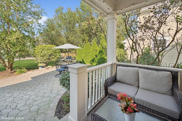 view of patio with outdoor dining area and an outdoor living space