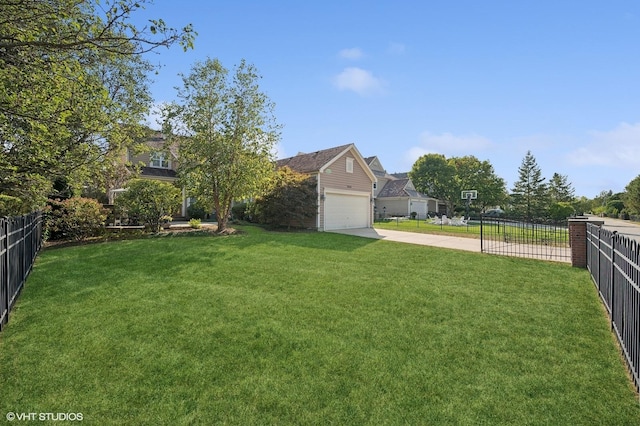 view of yard featuring a garage and fence