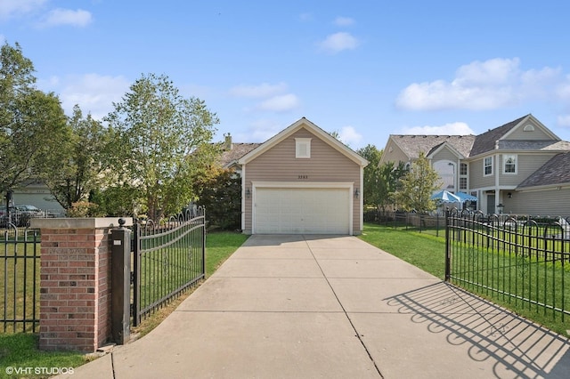 view of front of property with a garage, an outbuilding, fence, and a front lawn