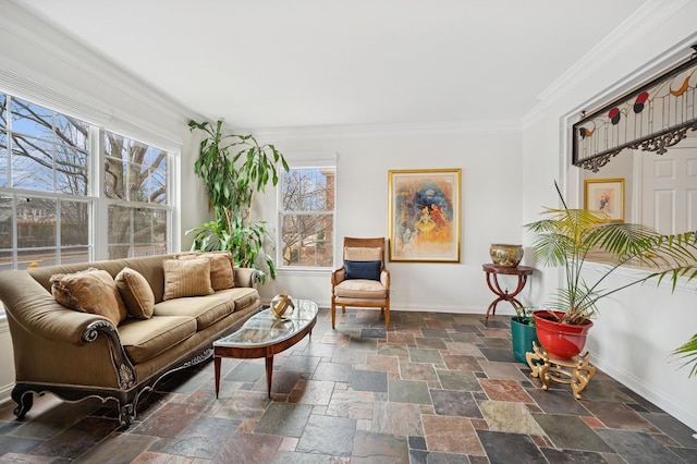 interior space with ornamental molding, stone tile flooring, and baseboards