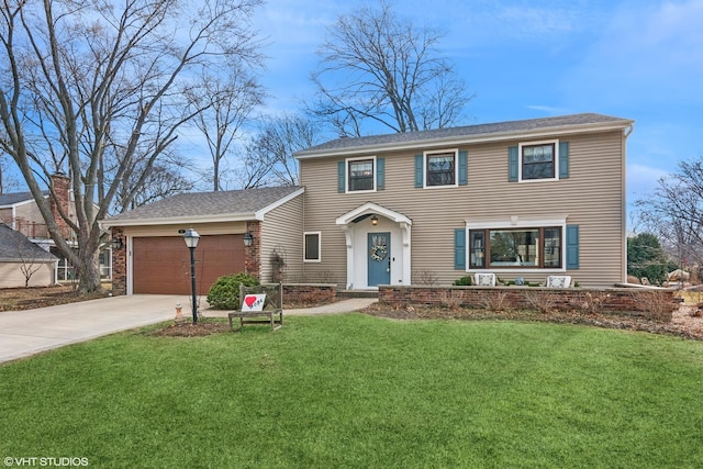 view of front facade with driveway, an attached garage, and a front lawn