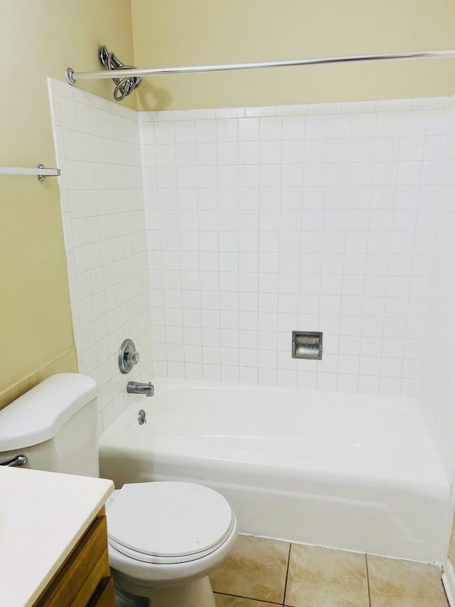 bathroom with toilet, shower / bath combination, tile patterned flooring, and vanity