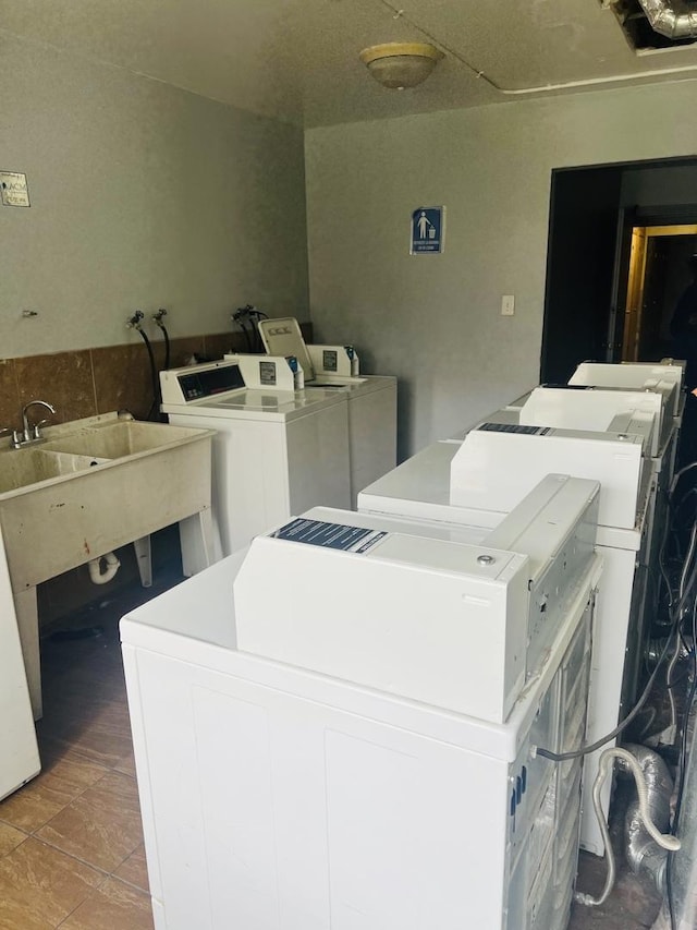 community laundry room with washer and clothes dryer