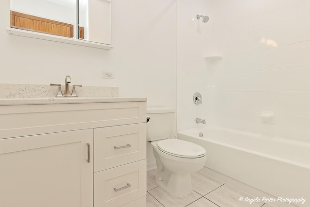 bathroom with shower / bath combination, vanity, and toilet