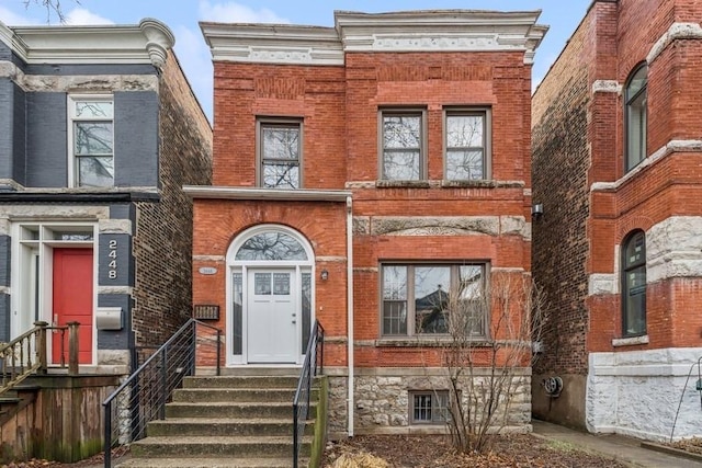 view of front of property featuring brick siding