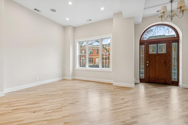 entryway with visible vents, plenty of natural light, and light wood-style flooring