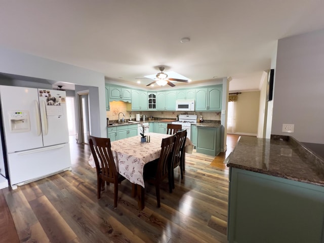 dining room with dark wood-style floors and a ceiling fan