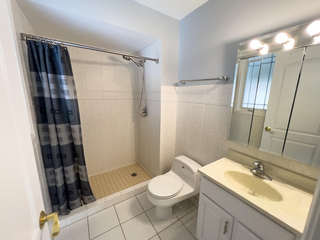 full bath featuring toilet, vanity, tile walls, a shower stall, and tile patterned floors