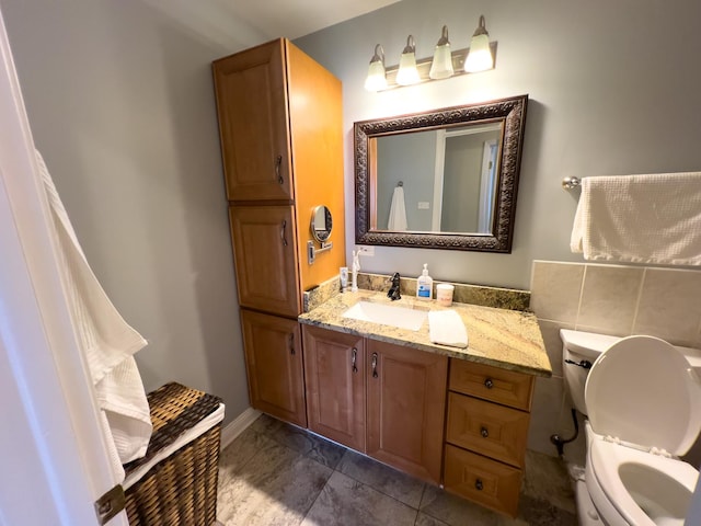 bathroom with toilet and vanity