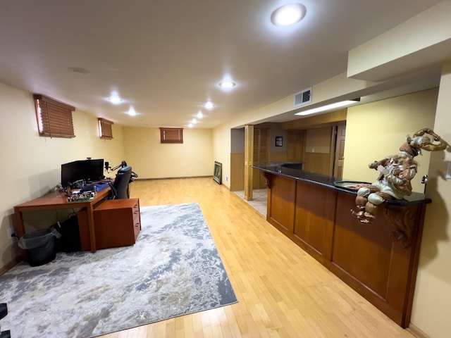 office space featuring recessed lighting, visible vents, and light wood finished floors