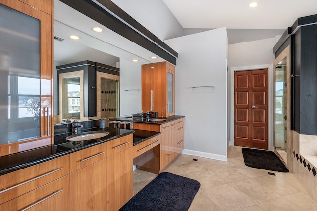 bathroom featuring a stall shower, vanity, baseboards, and recessed lighting