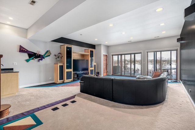 living area with recessed lighting, carpet flooring, visible vents, and baseboards