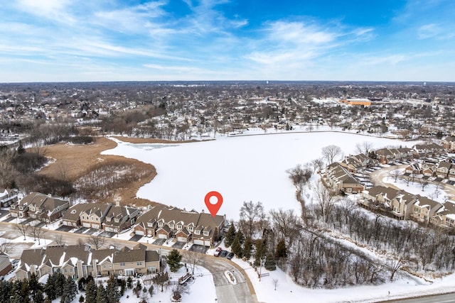 snowy aerial view featuring a residential view