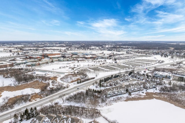 snowy aerial view with a residential view