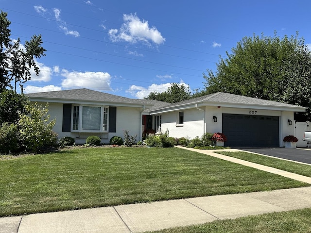 ranch-style home featuring a garage, driveway, roof with shingles, a front lawn, and brick siding