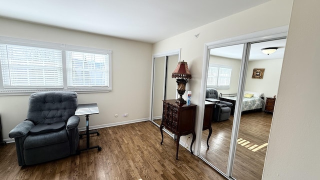 interior space with wood finished floors and baseboards