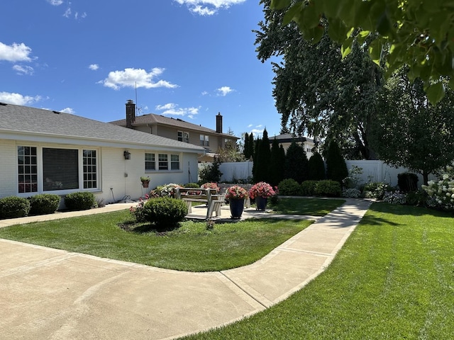 view of yard featuring a patio area and fence