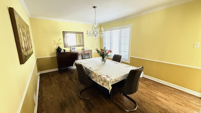 dining space with a notable chandelier, baseboards, dark wood finished floors, and crown molding